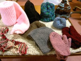 Hand-knitted scarves, hats, mittens donated by "Ms Warmheart"