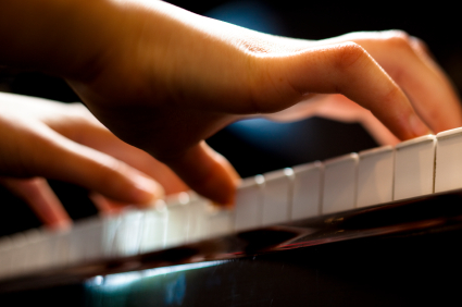 Child's hands playing Chopin