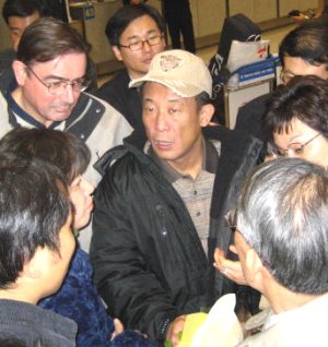 Friends greet Choi at airport