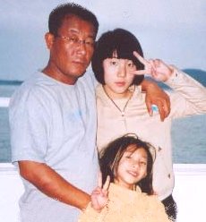 Choi Yong-hun with his two daughters